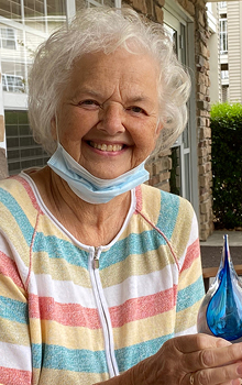 Donor holding her droplet sculpture